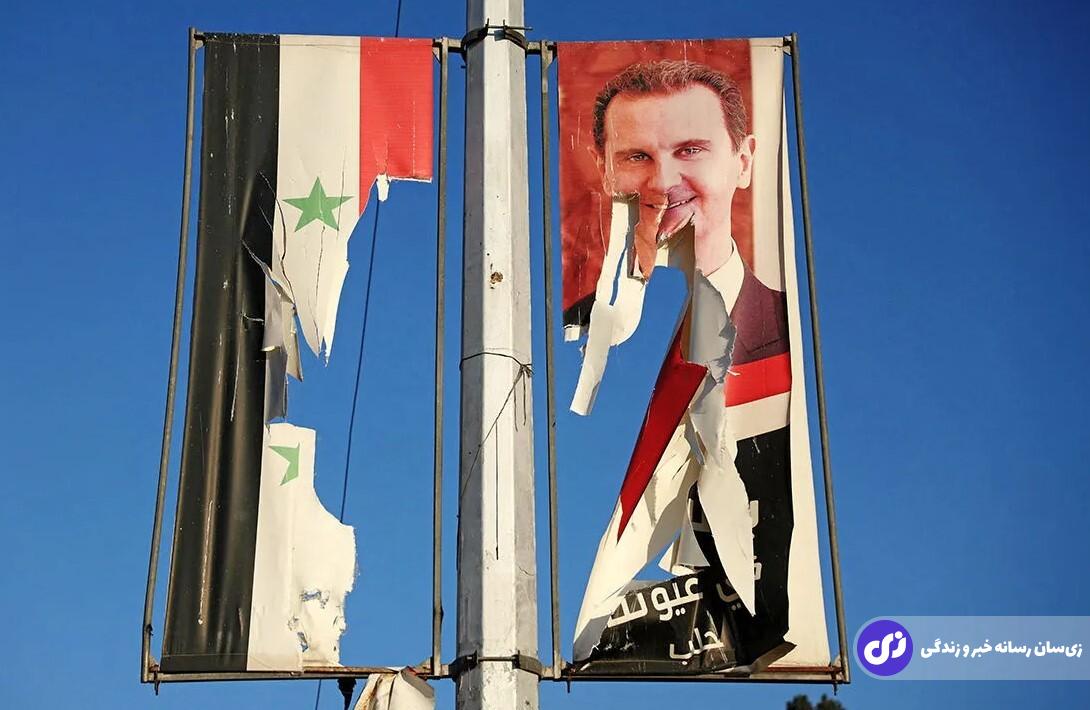پوستر بزرگ بشار اسد که بعد از سقوط دمشق توسط مخالفان پاره شده است