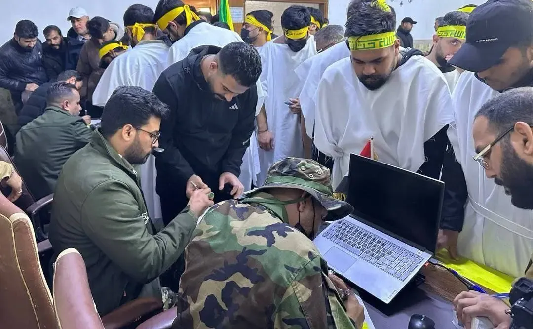 تصویر ثبت‌نام نیرو‌های مقاومت عراق برای دفاع از ایران